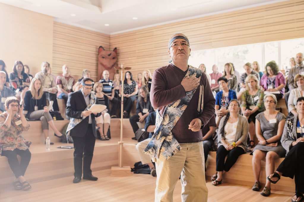 Mark Point leading a prayer at the Indigenzing the Academy Conference at UFV