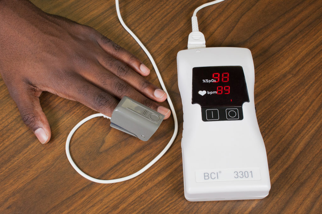 Image showing pulse oximeter in use on simulated patient