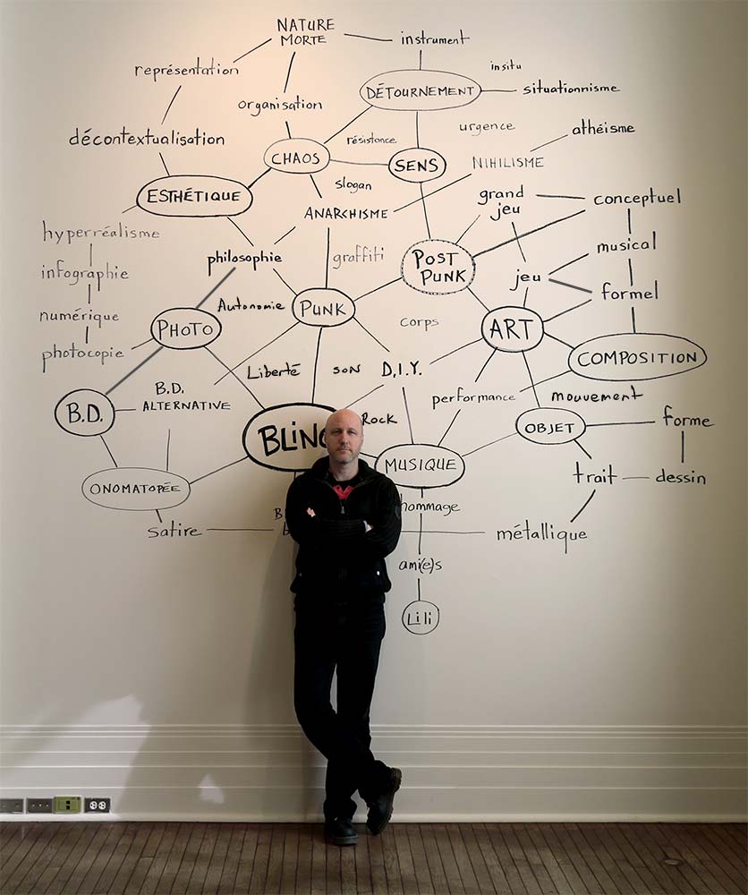 Sebastien Pesot standing in front of mind map;Exhibition "L’anatomie du Bling", Musée des beaux-arts de Sherbrooke