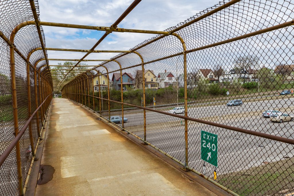 A pedestrian bridge between the divided Rondo neighborhood in St. Paul, MN. Once a thriving African American community, Rondo was split in two by the construction of Interstate Highway 94 in the 1970s. Today Rondo leaders are advocating for more substantial connections.