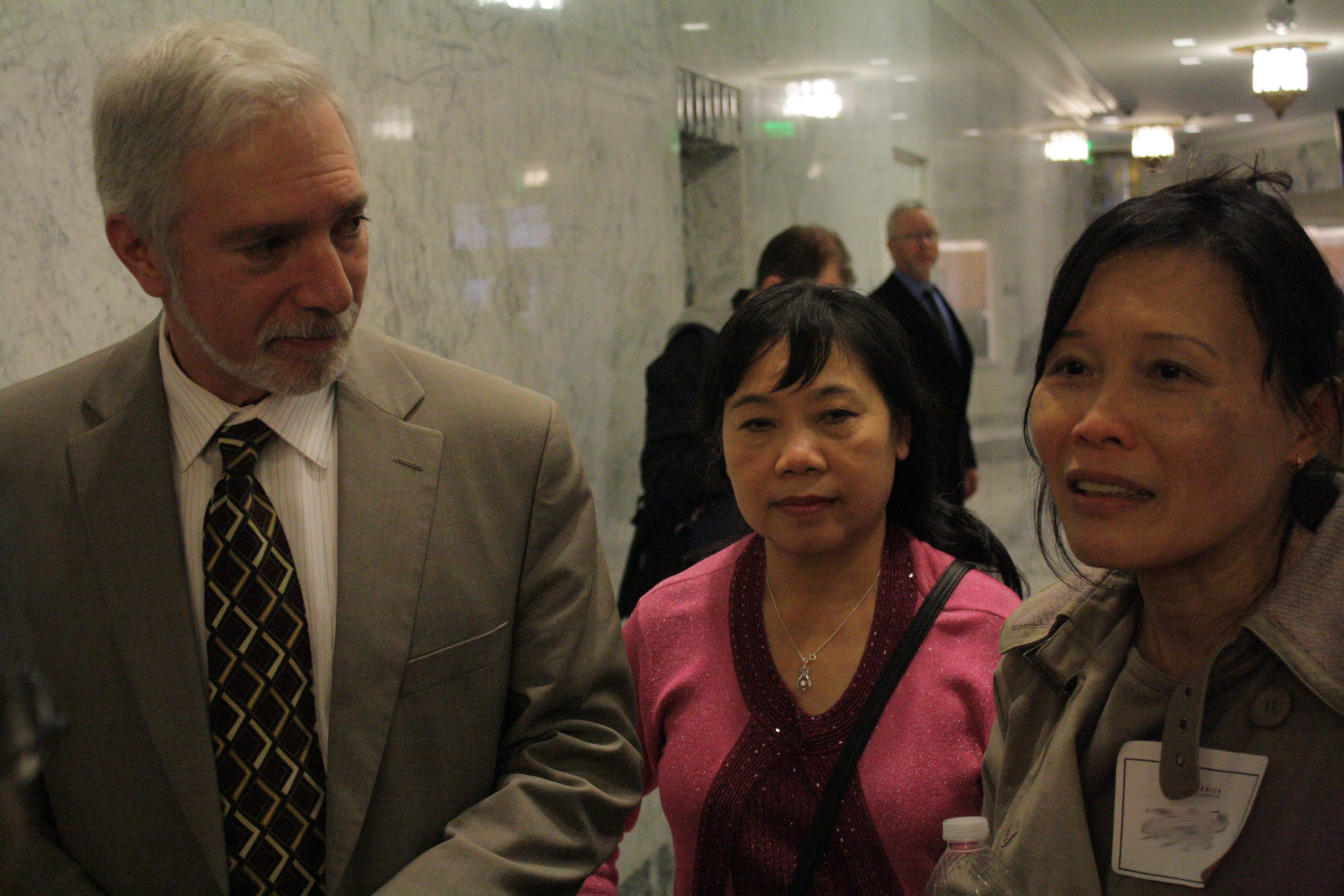 Three people in a government building